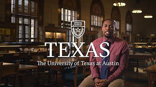 Portrait of a man inside a historic University of Texas at Austin building.